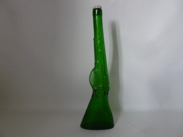 Aparte vintage fles in pistool vorm.