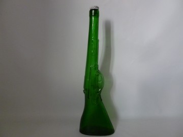 Aparte vintage fles in pistool vorm.